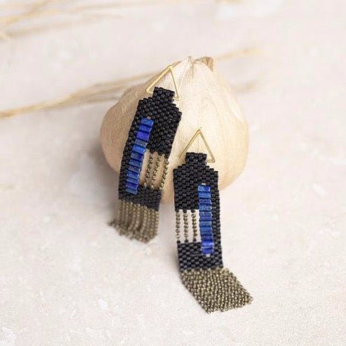 Dangle Earrings made of black and lapis beads and antique brass chains. Handmade in Portland, OR.