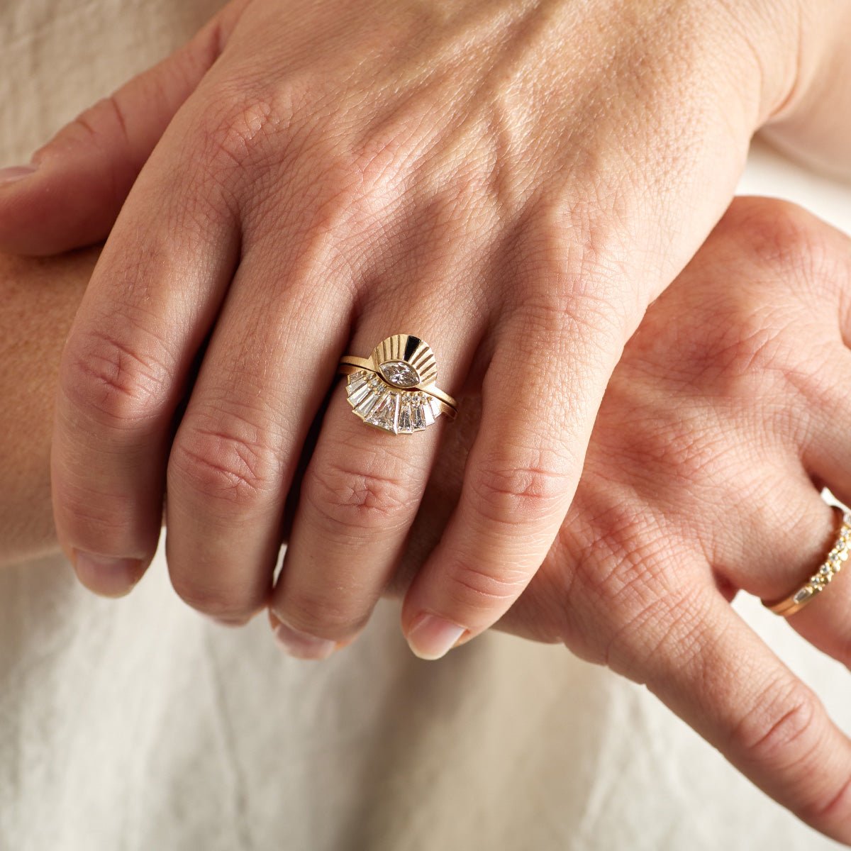 Model wears Aestus and Apricus rings on their left hand. Briefly shown on their right hand are the Alma and Itero rings. All rings are made of 14K recycled gold and made in Portland, Oregon.