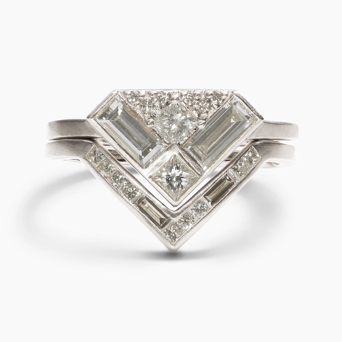 The Aurore ring stacked on top of the Altus ring. Both feature lab-grown diamonds and recycled 14K white gold.