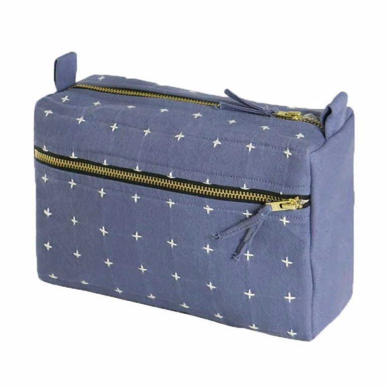 Square toiletry bag in the shade Slate with white cross-stitch detailing. Designed by Anchal in Louisville, Kentucky and handmade in Ajmer, India.