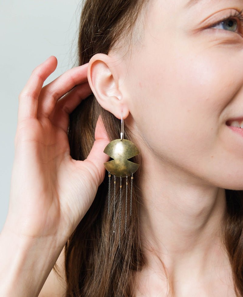 betsy & iya Aztec Dreamcatcher earrings with chain dangles. Geometric brass focal piece with gunmetal foxtail chain.