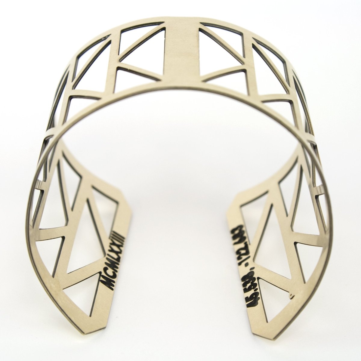 Portland made gold brass cuff with cascading triangle cutouts.