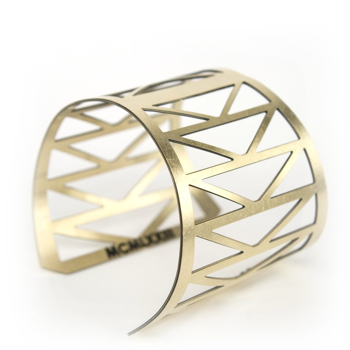 betsy & iya Fremont Bridge cuff with triangular geometric cutouts.