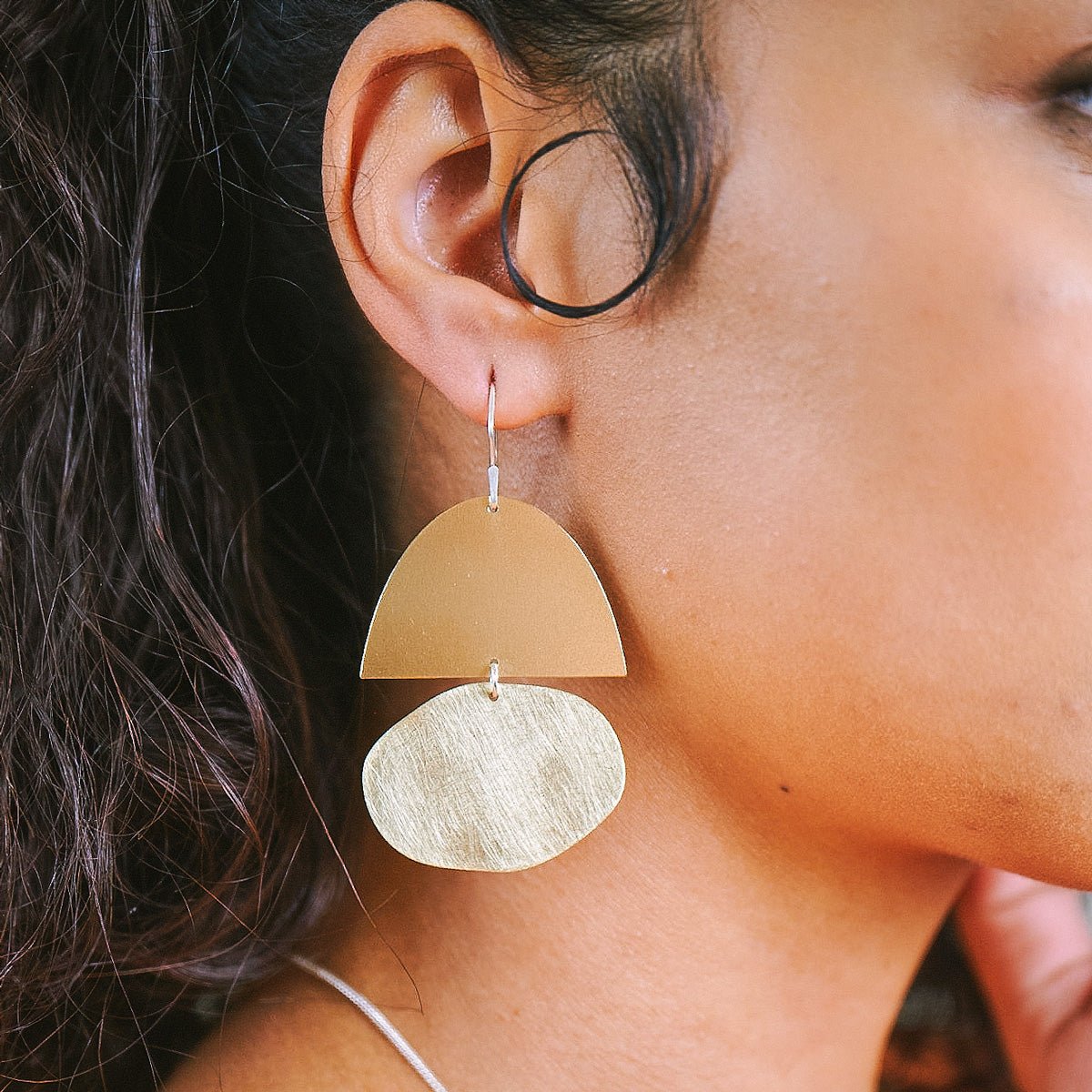 Mazi earrings in brush-finished and polished brass. Designed and handcrafted in Portland, Oregon.