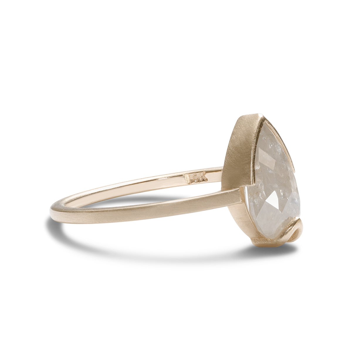 Pear-shaped Ignis ring. Features a salt & pepper diamond set in recycled 14K gold. All stones and materials are conflict free.