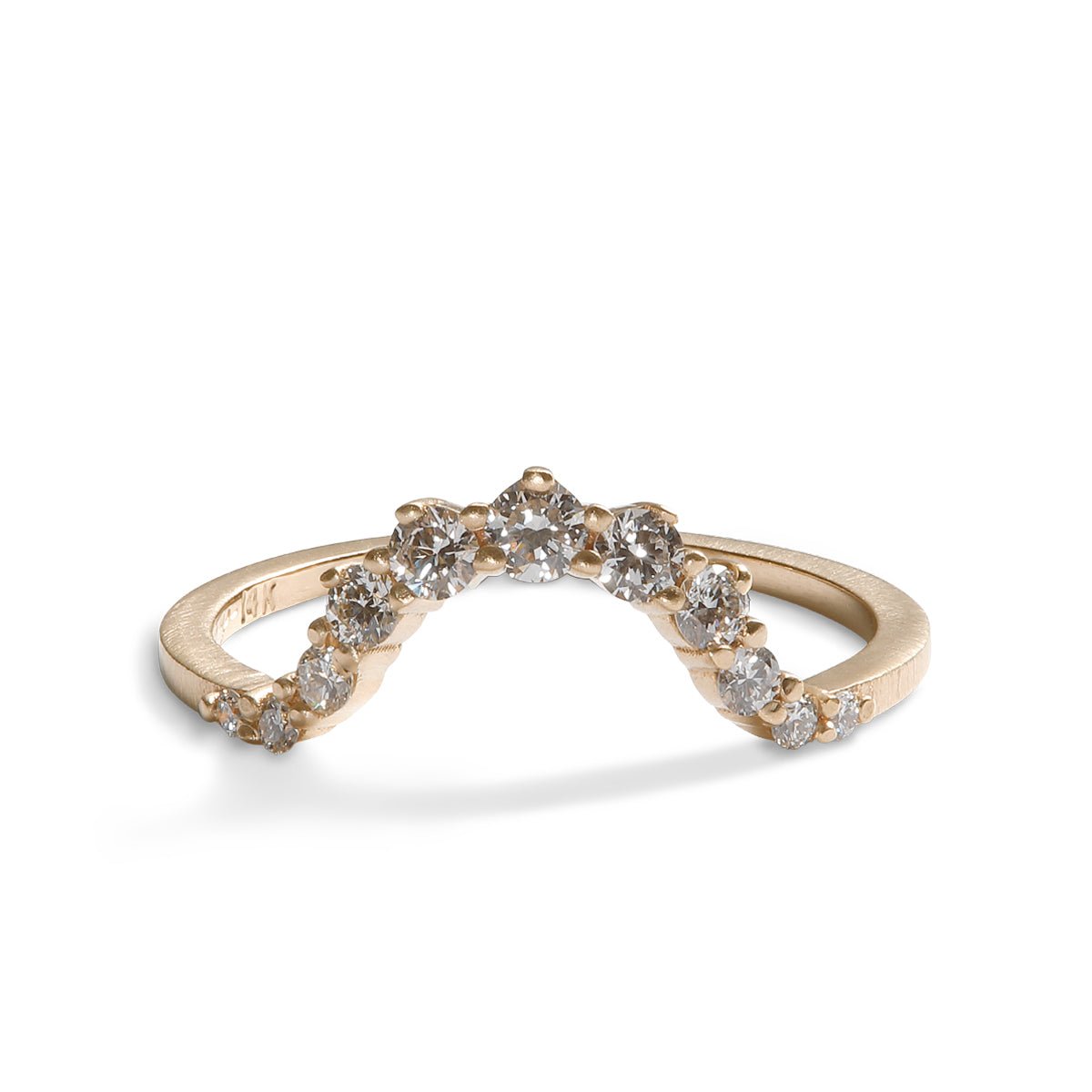 Arched Ortus ring, with prong set lab-grown diamonds. This contoured stacking band is made of 14K recycled gold.