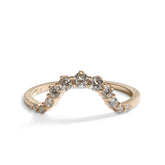 Arched Ortus ring, with prong set lab-grown diamonds. This contoured stacking band is made of 14K recycled gold.