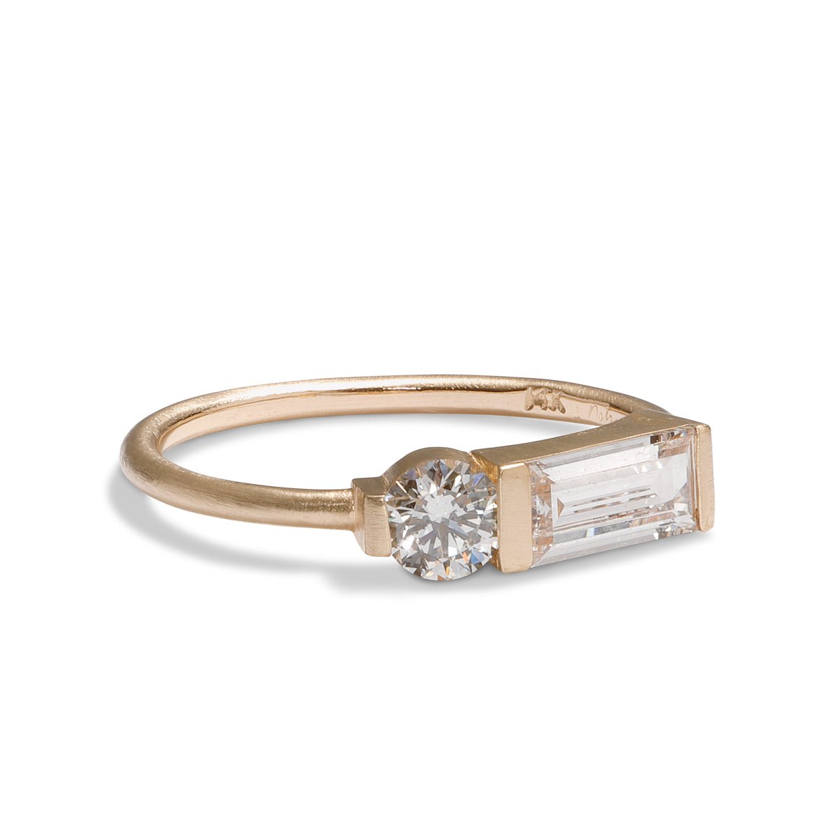 Otium ring with baguette and brilliant-cut round lab-grown diamonds. Set in 14K recycled gold. All stones and materials are conflict-free.