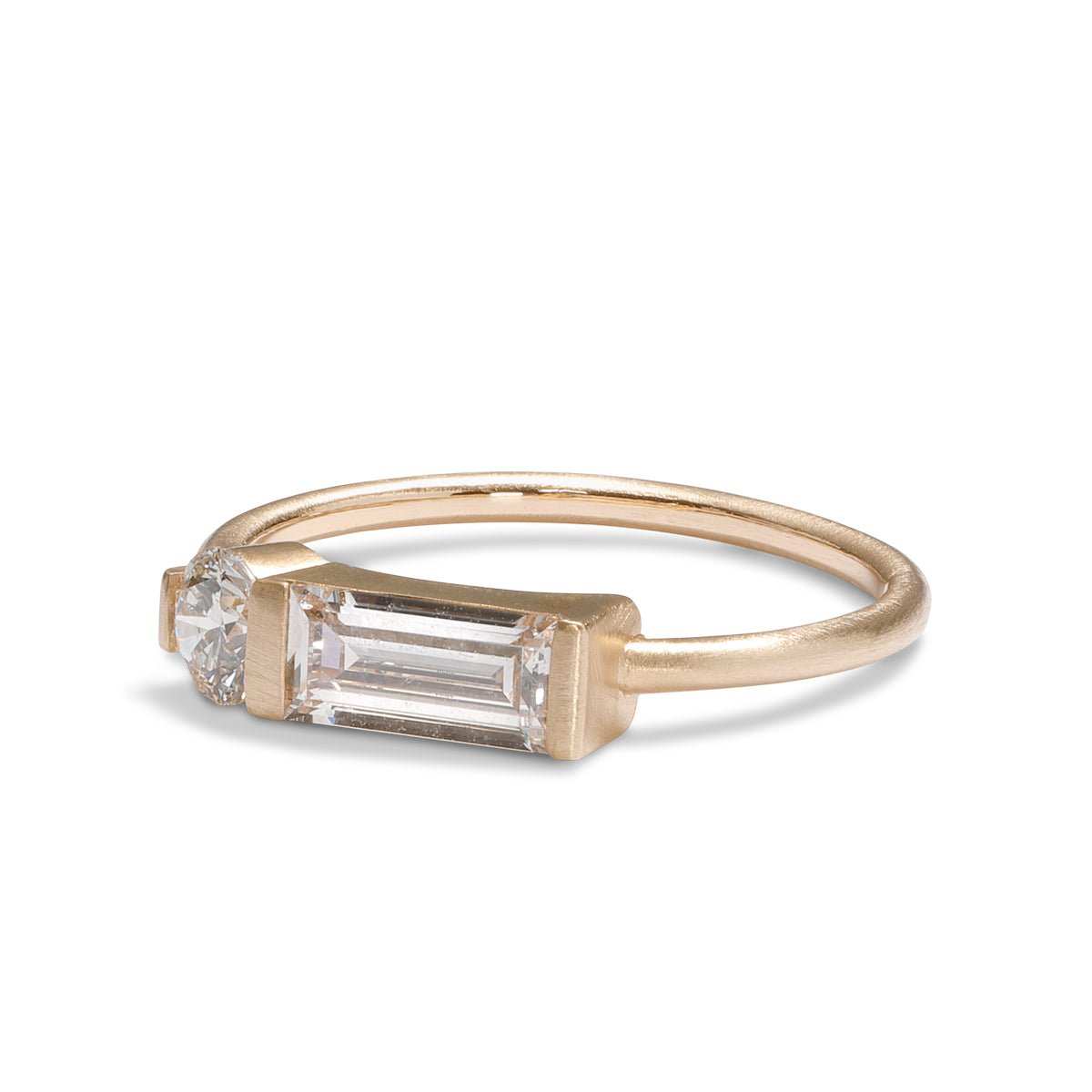 Otium ring with baguette and brilliant-cut round lab-grown diamonds. Set in 14K recycled gold. All stones and materials are conflict-free.