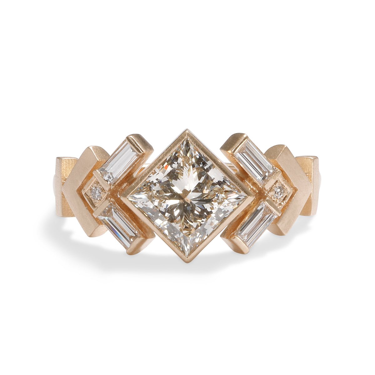 Geometric Uro ring with lab-grown princess cut diamond center. Chevron motif band in 14K recycled gold.