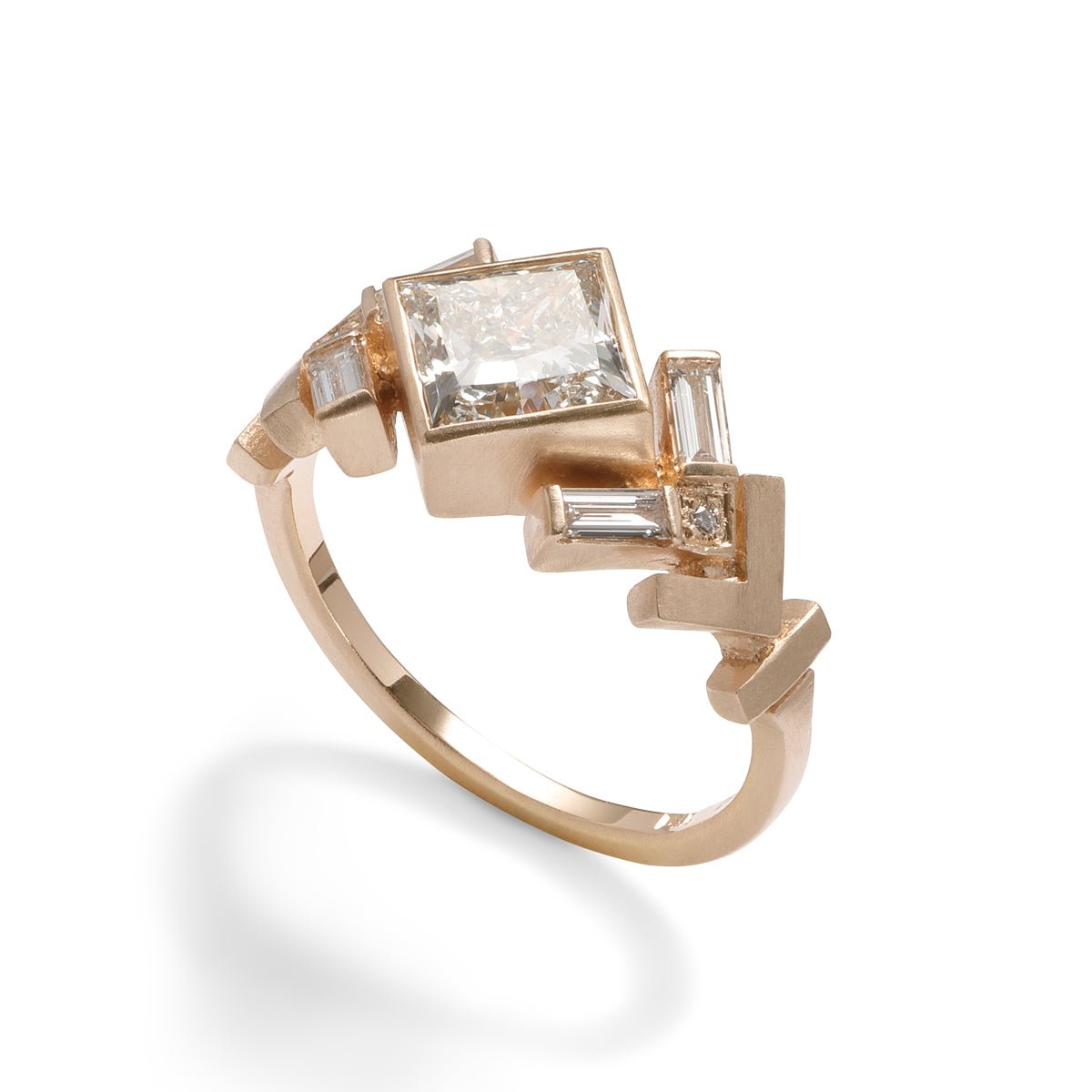 Geometric Uro ring with lab-grown princess cut diamond center. Chevron motif band in 14K recycled gold.