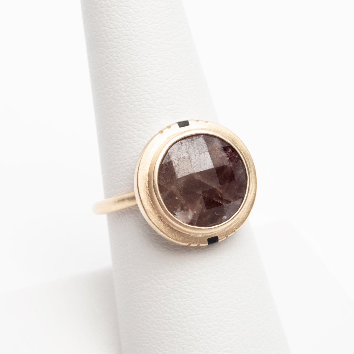 An example of a dark, untreated ruby set in the Flos ring. Untreated rubies vary in coloring.