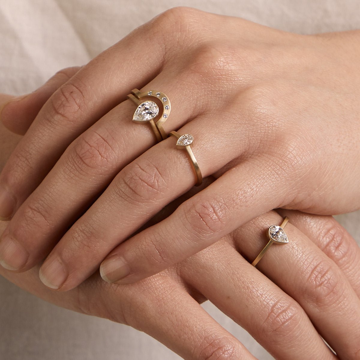 Model wears the Votum rings and Cor ring.