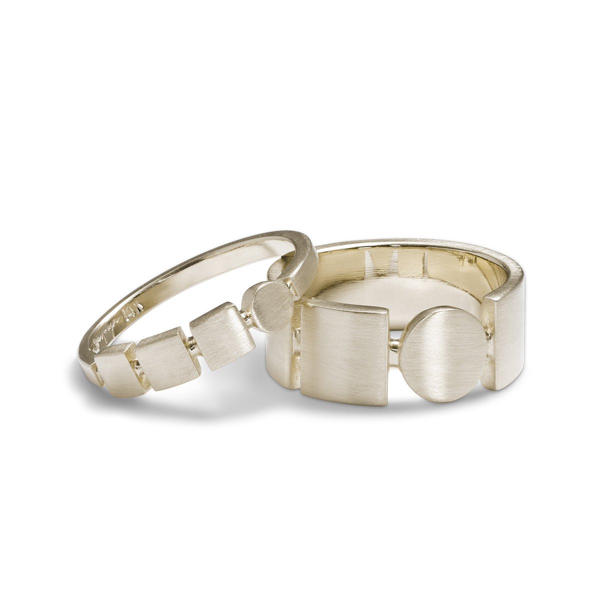Square and circle motif Figura and Forma rings. Made with 14K recycled white gold in Portland, Oregon.