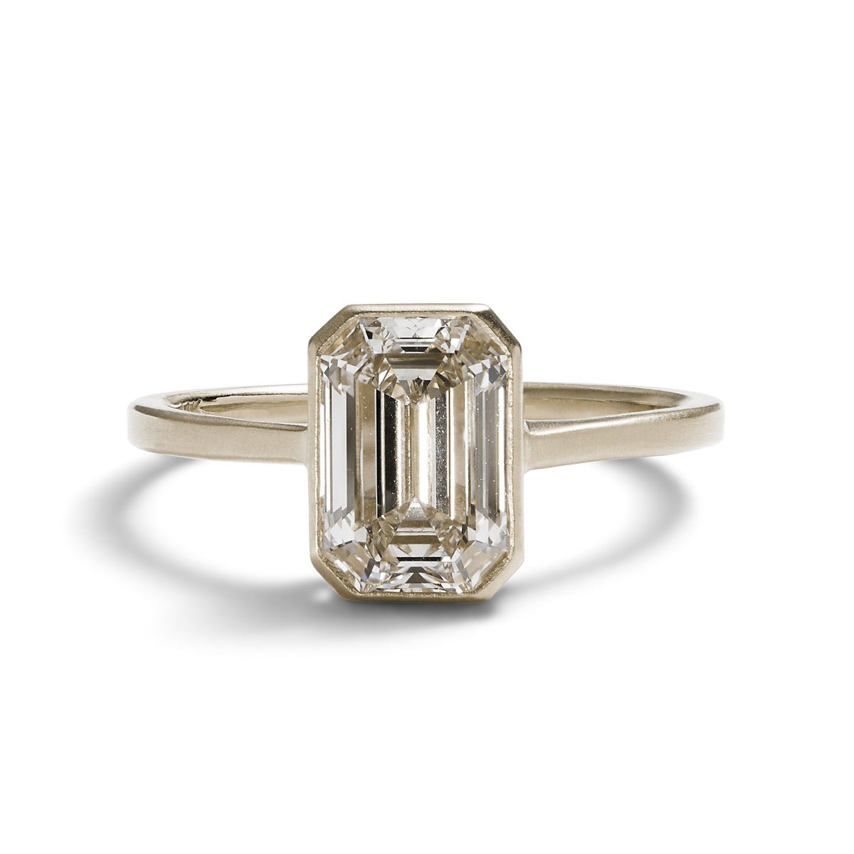 Honos ring in a 14K recycled white gold band with an emerald cut lab-grown diamond (1.75 ct).