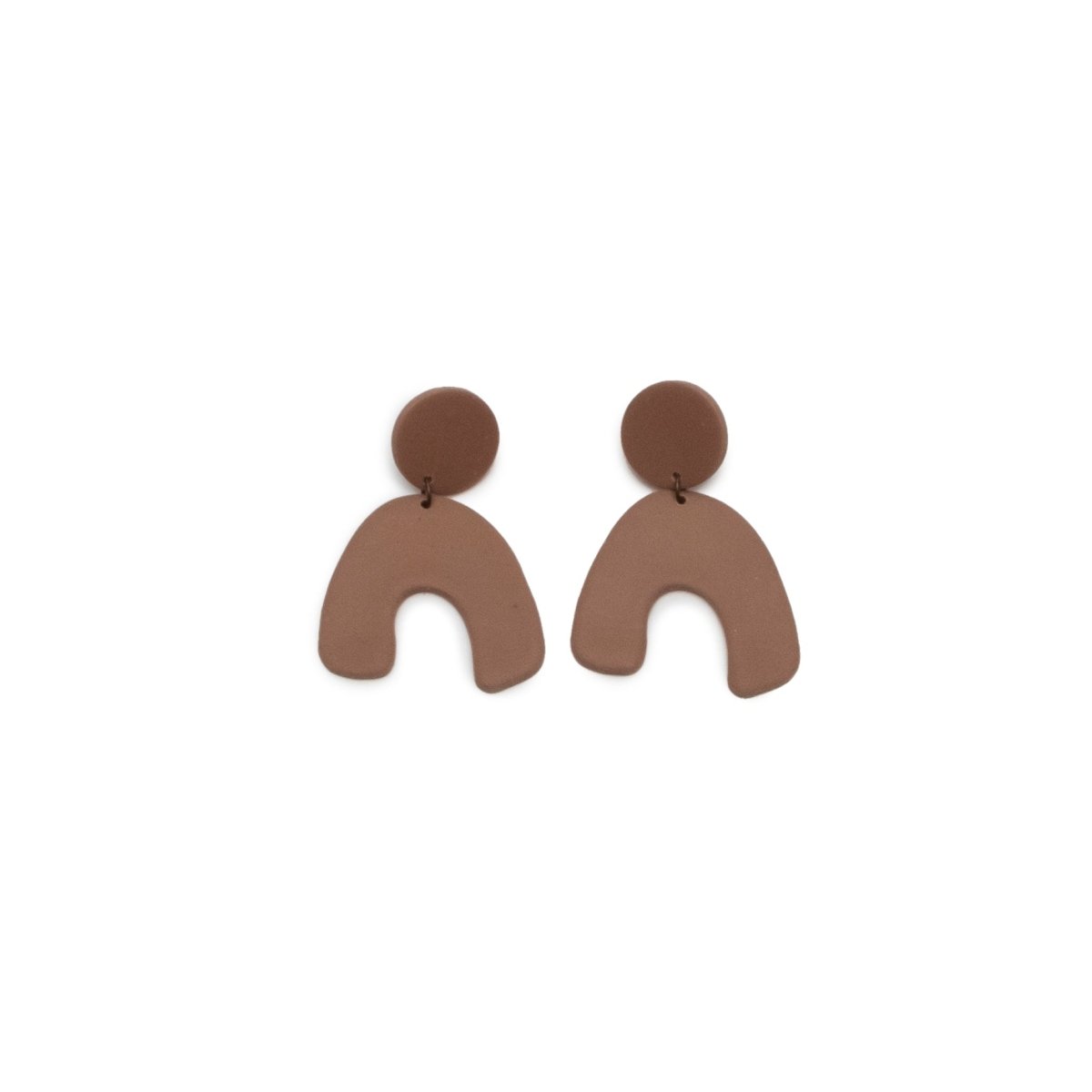 A pair of light brown polymer clay earrings. Features a small circle and an upside down "U" shape attached with stainless steel. Crafted by hand in Portland, OR by The Baked Clay Studio.