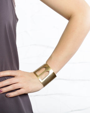 Brooklyn Bridge cuff bracelet pictured on a model's arm for scale.