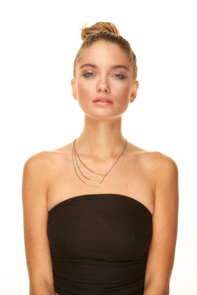 Model shot of betsy & iya golden sting necklace.