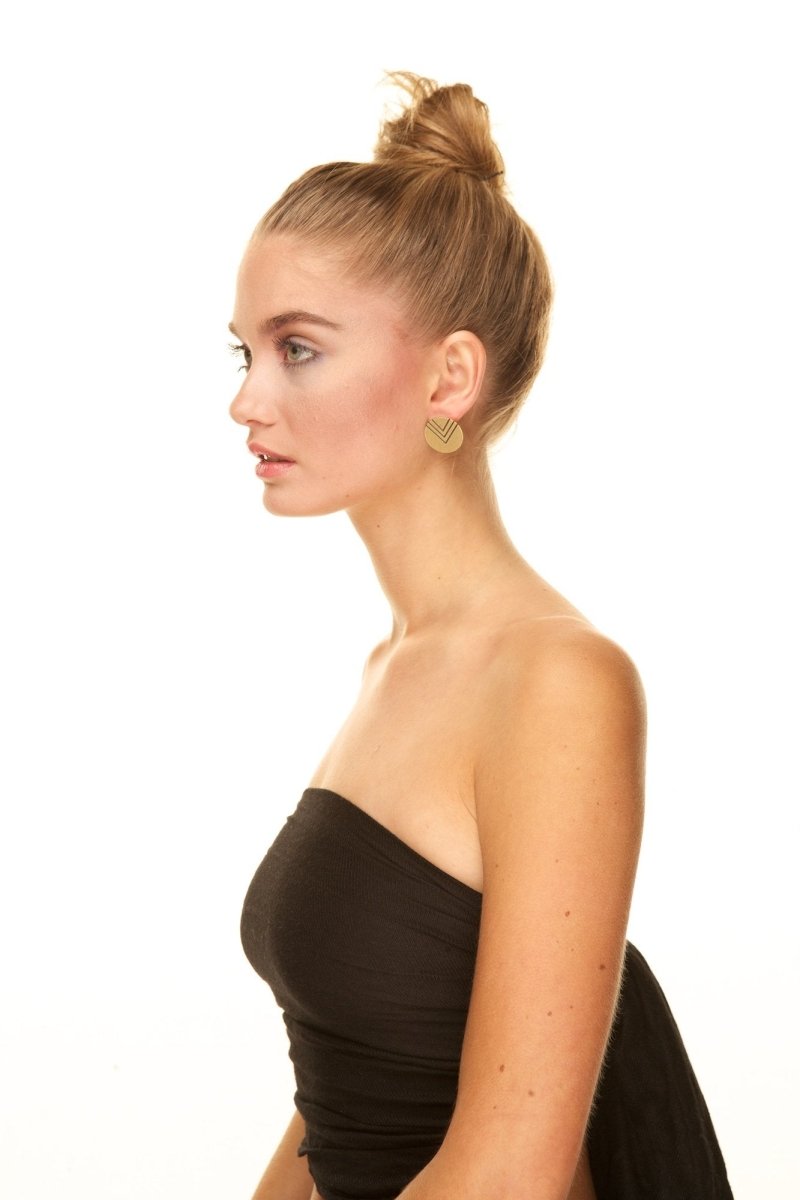 Model wearing betsy & iya General stud earrings.