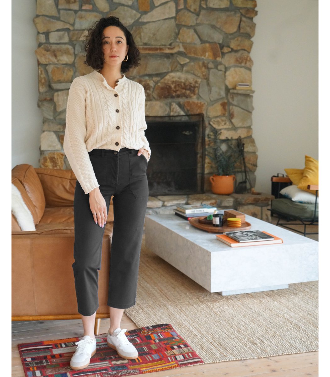Model wears a straight leg cropped work pant in black. The James Pant in Black is designed by Loup and made in New York City, USA.