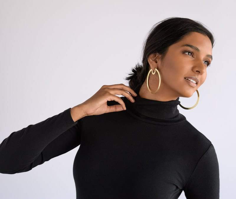 Bombona Large Hoop Earrings in Brass on model