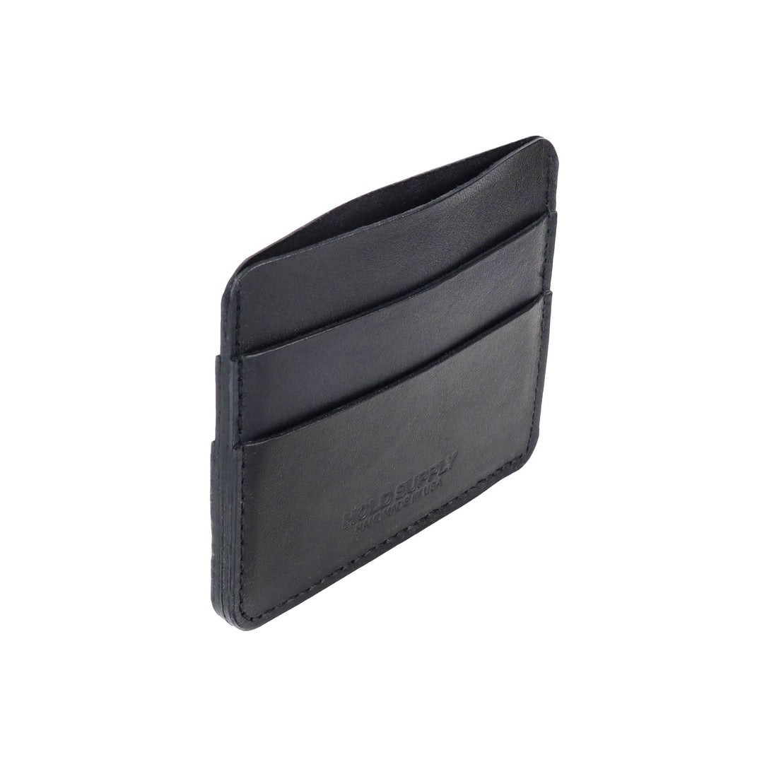 A narrow wallet sized card holder with multiple compartments. The Card Holder Wallet in Black is designed and handcrafted by Hold Supply in Anaheim, California.
