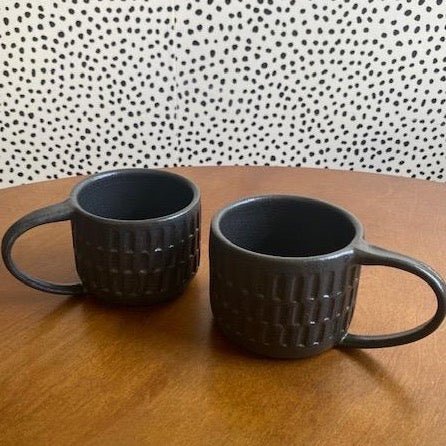 Wheel thrown hand carved mug with a matte black finish. Handmade by Amy A ceramics in Portland, Oregon.