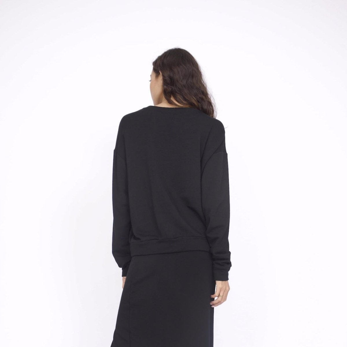 Oversized long sleeve sweater in the shade Black. The Boyfriend Sweater is designed by Corinne Collection and made in Los Angeles, CA.