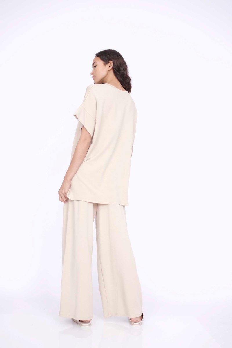 Oversized tunic style top with side slits. The Eleanor Tunic in Hazelwood is designed by Corinne Collection and made in Los Angeles, CA.