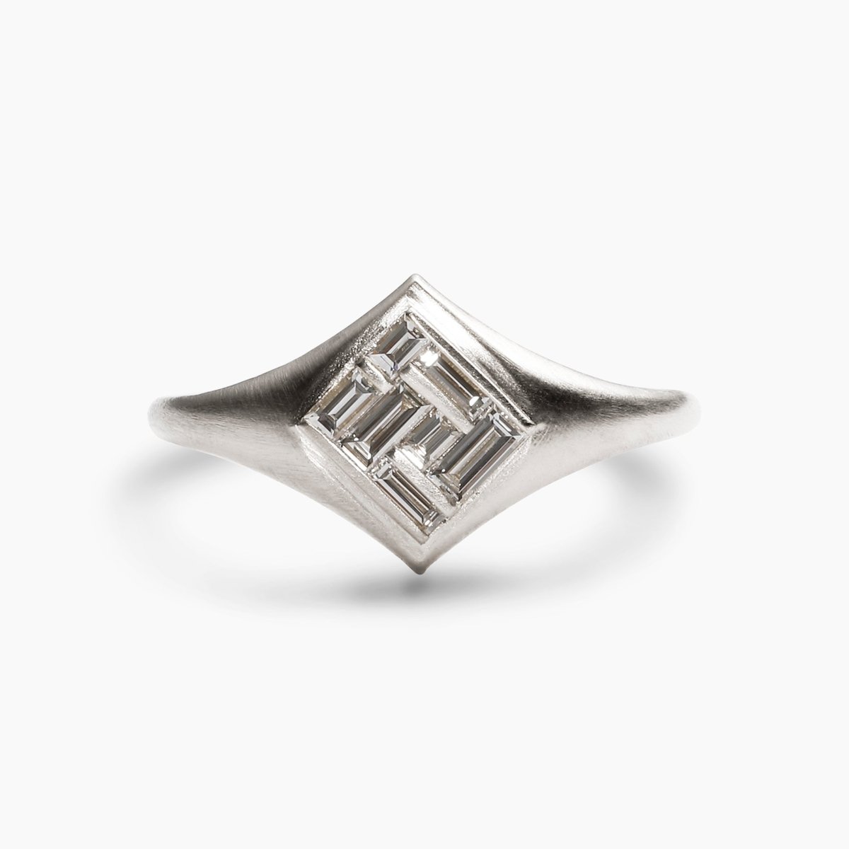 Elicio ring featuring channel-set lab-grown diamonds in a 14K white gold band. Designed and handcrafted in Portland, Oregon.