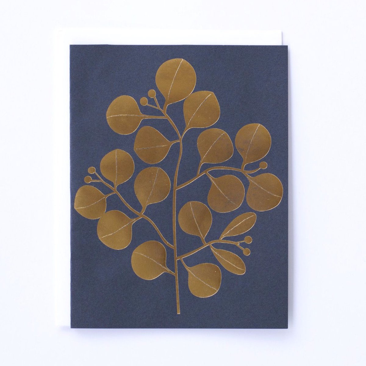 Navy blue card with leaves foil printed in gold. Made with recycled paper by Banquet Atelier in Vancouver, British Columbia, Canada.
