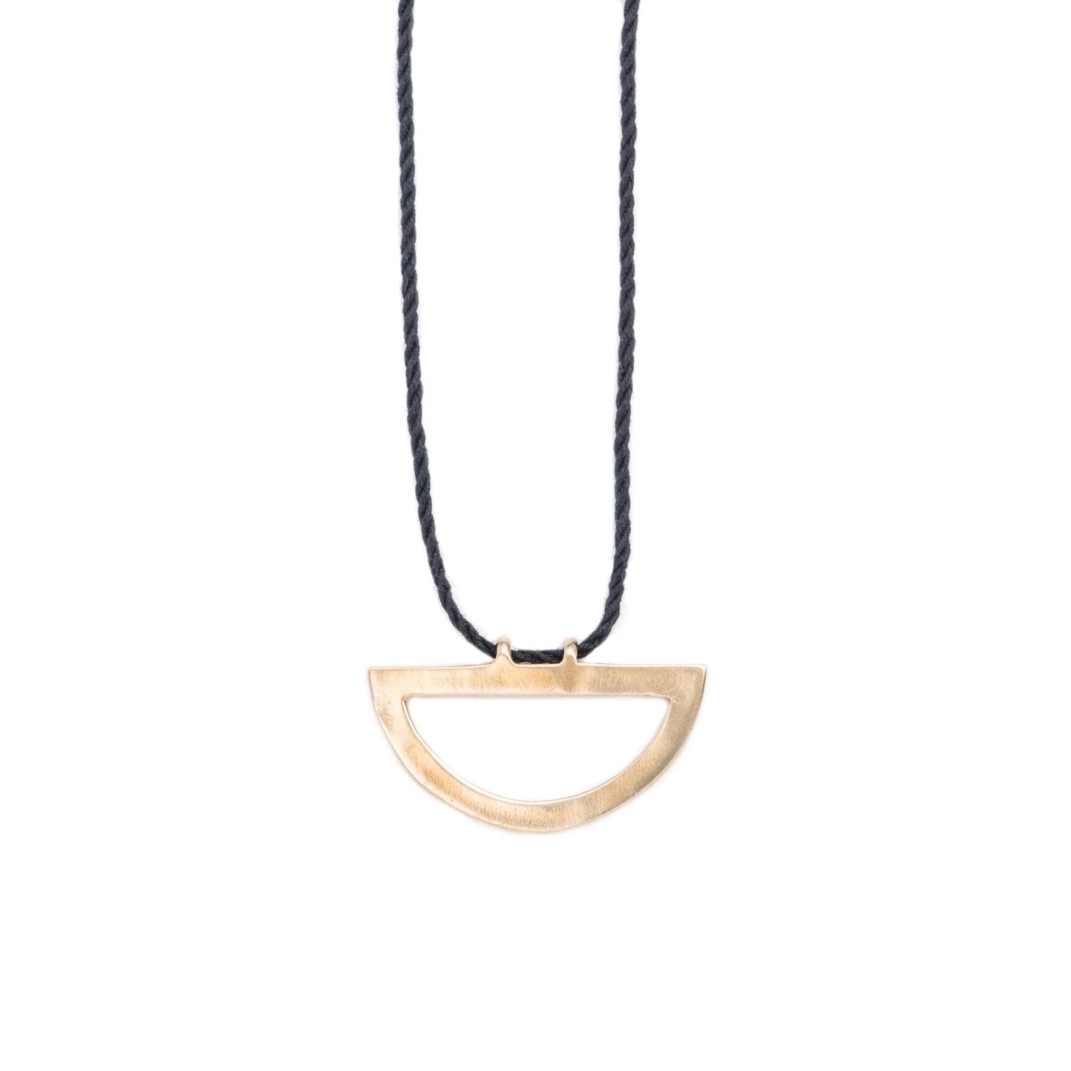 Modern, adjustable necklace of black Japanese cotton rope threaded along the long end of a cast bronze semi-circle pendant. Hand-crafted in Portland, Oregon.