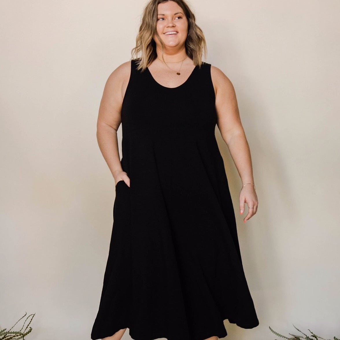 Relaxed sleeveless midi-length jumpsuit with pockets in the color True Black. The Lakeside Jumpsuit is designed by Mien and made in Los Angeles, CA.