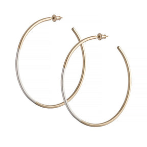 Minimalist, lightweight, mixed metal hoops of 14k yellow gold and sterling silver hand-forged wire, with 14k gold earring posts and ear nuts. Size large, two and one-eighth inches in diameter. Hand-crafted in Portland, Oregon.