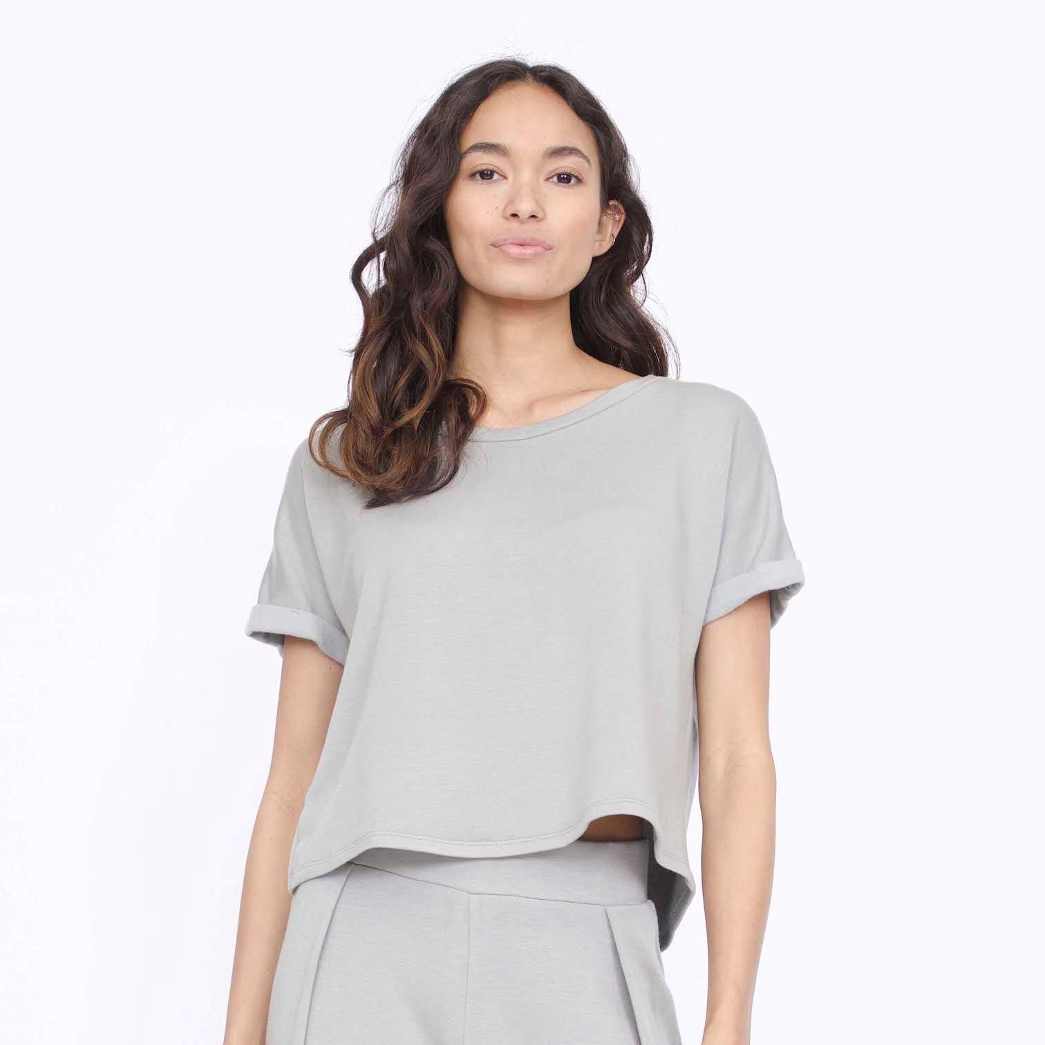 Rolled cuff tee with a slightly longer back in the color Stone. Fabric and top made in Los Angeles, CA by Corinne Collection.
