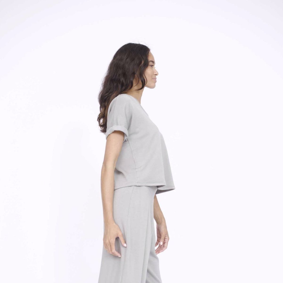 Rolled cuff tee with a slightly longer back in the color Stone. Fabric and top made in Los Angeles, CA by Corinne Collection.