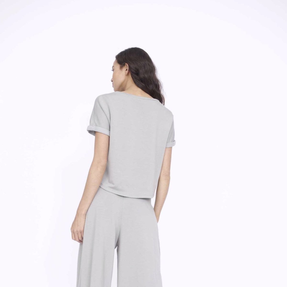 Rolled cuff tee with a slightly longer back in the color Stone. Fabric and top made in Los Angeles, CA by Corinne Collection.