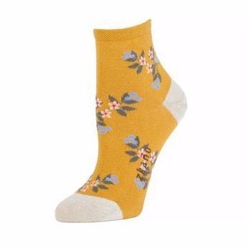 Mustard yellow sock with blue, green, red and white floral pattern. The heel and toe are white with the Zkano logo along the arch. The Mae Anklet Sock in Harvest Gold is from Zkano and made in Alabama, USA.