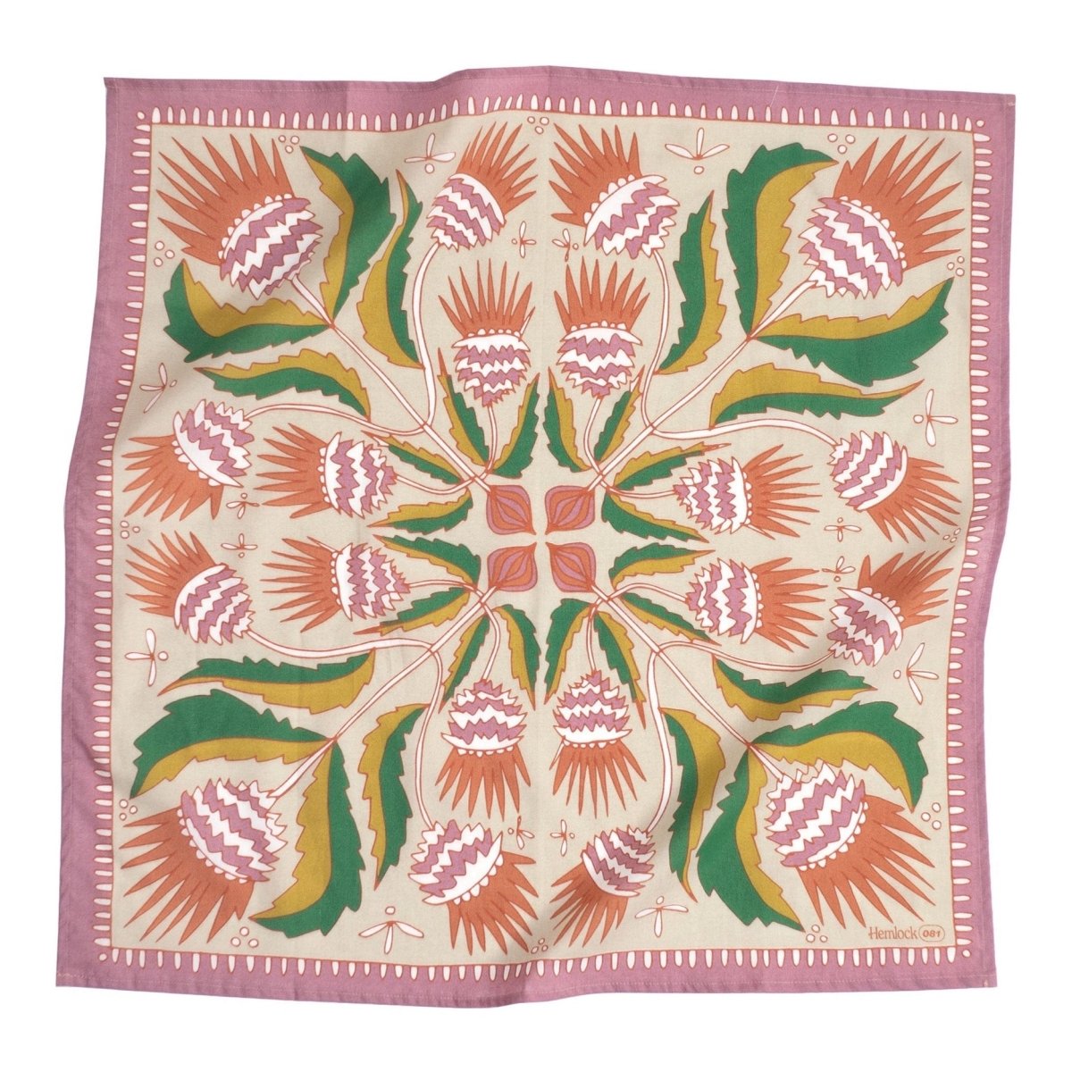 A pink, green, red and yellow bandana with floral and leaf illustrations. Designed by Hemlock Goods in Fulton, MO and screen printed by hand in India.