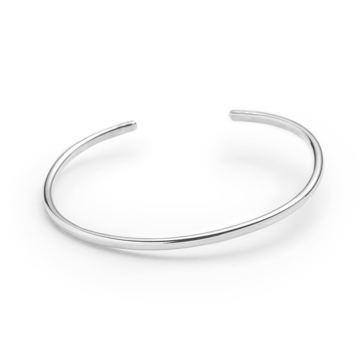 Classic, simple, and adjustable stacking cuff of hand-forged silver-filled wire, with etched notch details on both ends of the cuff. Hand-crafted in Portland, Oregon.