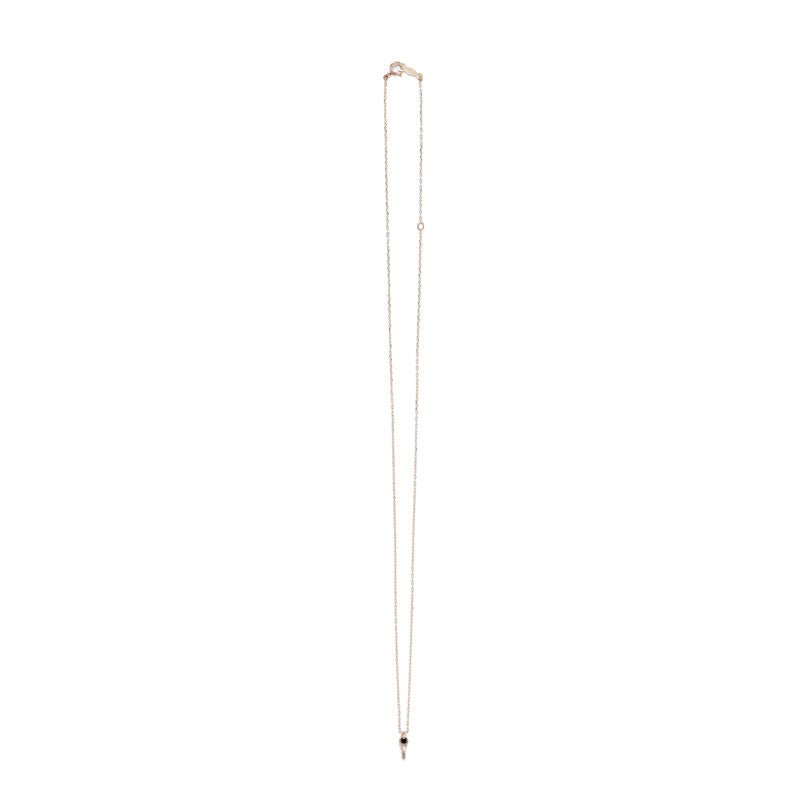 Tiny, ankh-shaped pendant of 14k yellow gold, topped with a round, bezel-set black diamond, and threaded with a delicate gold chain with spring-ring clasp. Hand-crafted in Portland, Oregon.