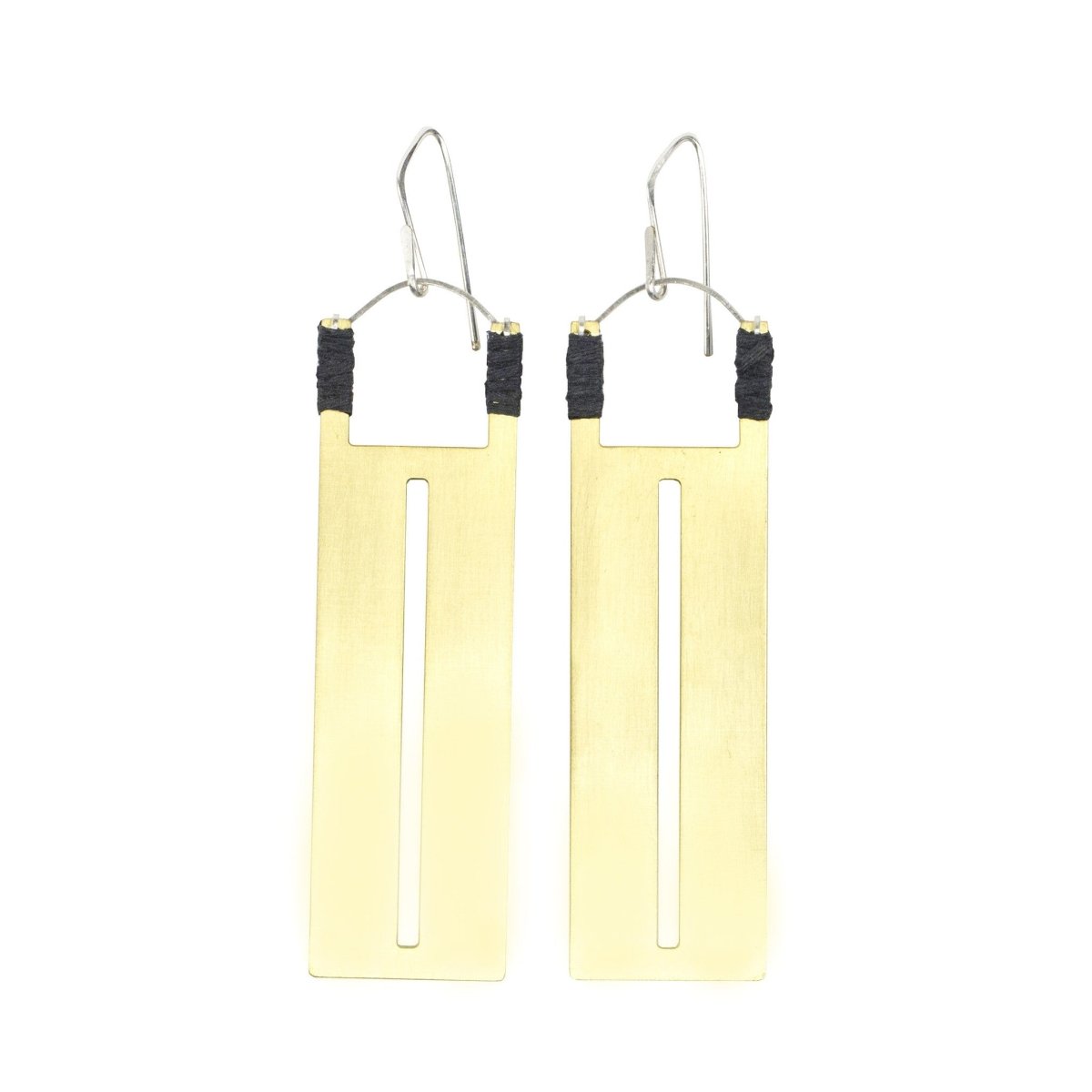 Rectangular brass pendants with thin slit cutouts down the center, accented with gray Japanese cotton thread and sterling silver earring wires. Hand-crafted in Portland, Oregon.