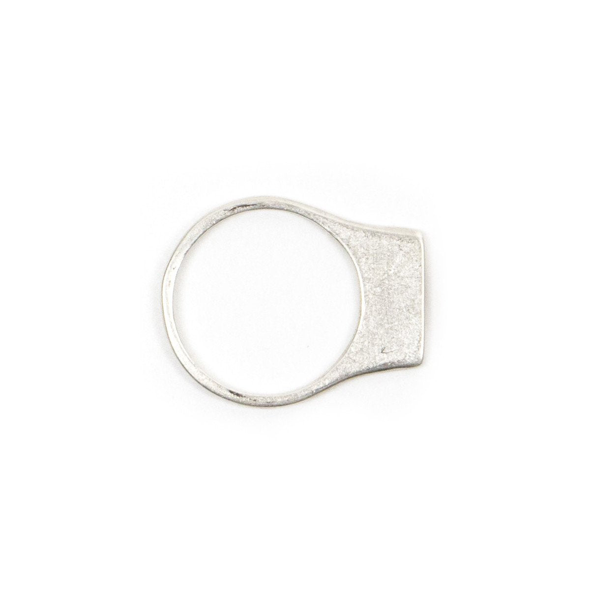 Contemporary and minimal silver stacking ring with an elongated curve that sits above the top of the finger. Hand-crafted in Portland, Oregon.