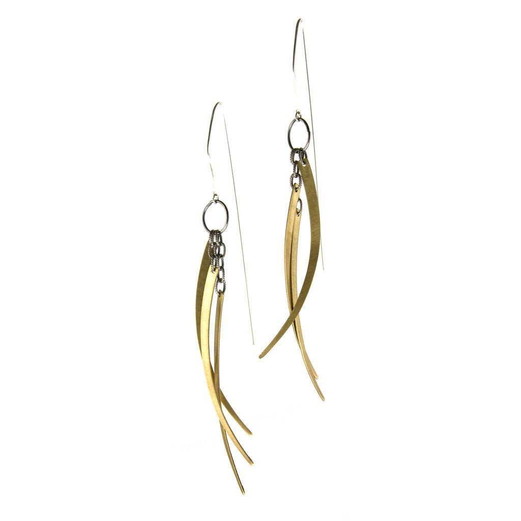 Handcrafted earrings with three dangling curved brass spikes.