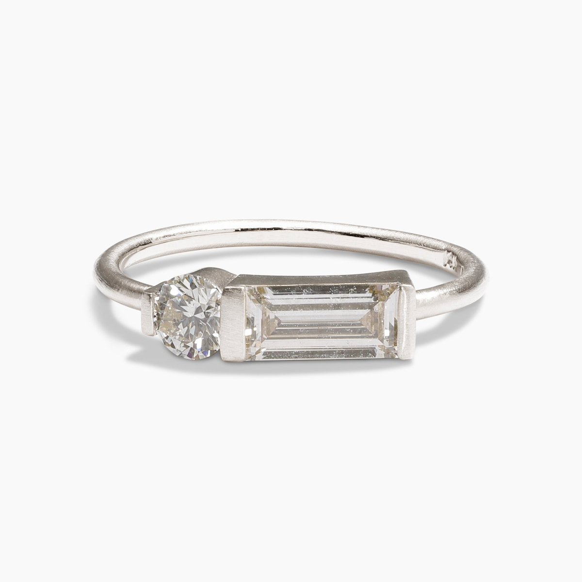 Otium ring with baguette and brilliant-cut round lab-grown diamonds. Set in 14K recycled white gold. All stones and materials are conflict-free.