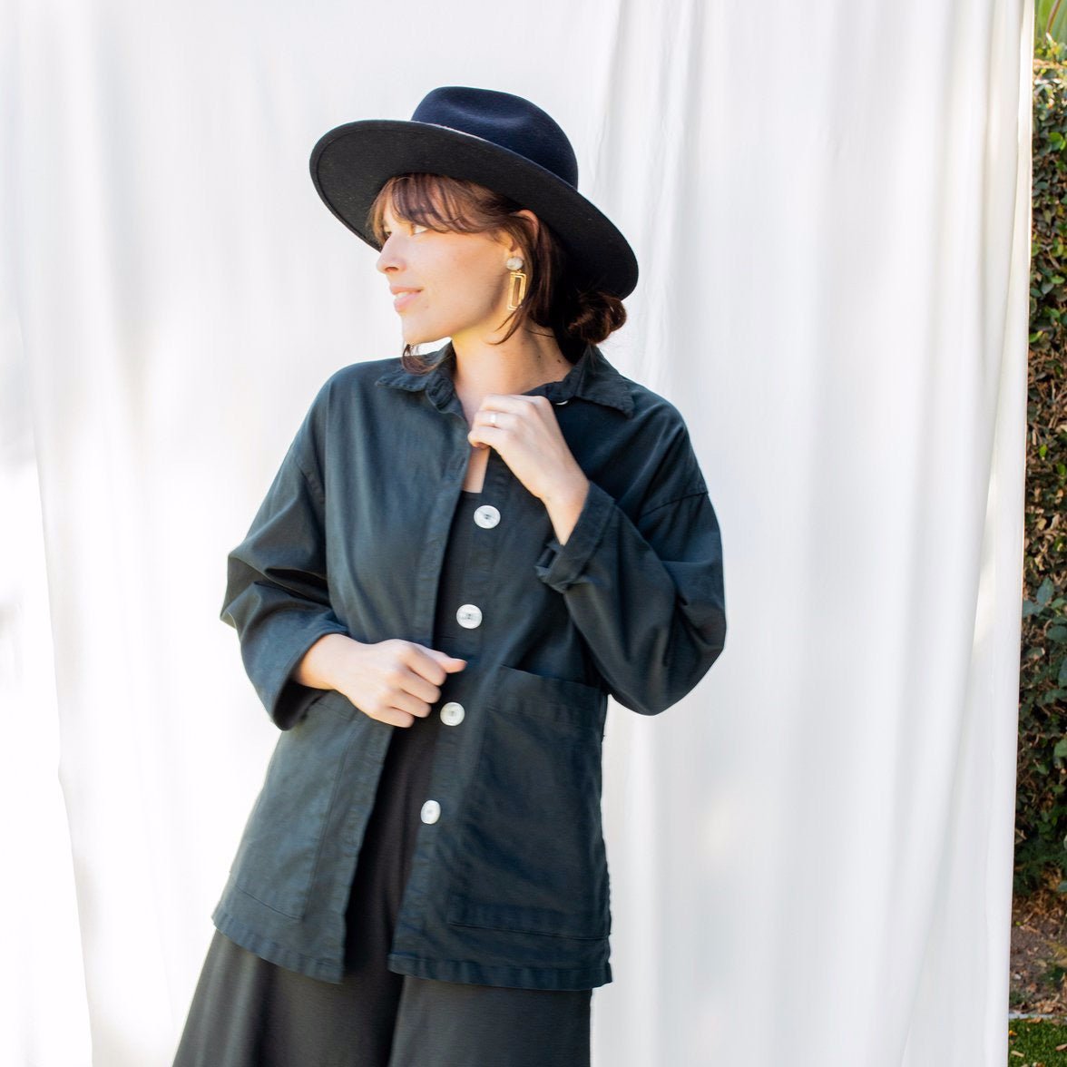 Chore jacket with off-white buttons and two oversized pockets in the color Black Forest. The Painter's Jacket is designed by Mien and made in Los Angeles, CA.