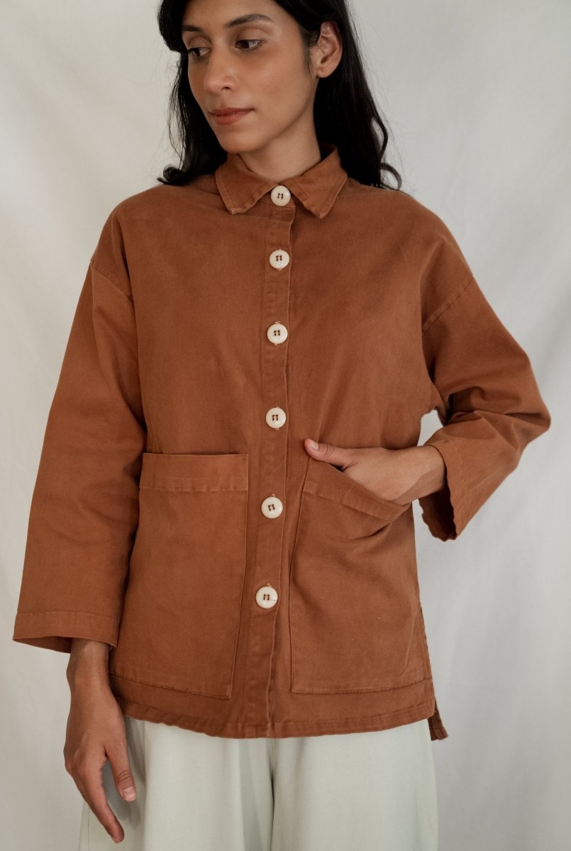 Chore jacket with off-white buttons and two oversized pockets in the color Saddle Brown. The Painter's Jacket is designed by Mien and made in Los Angeles, CA.