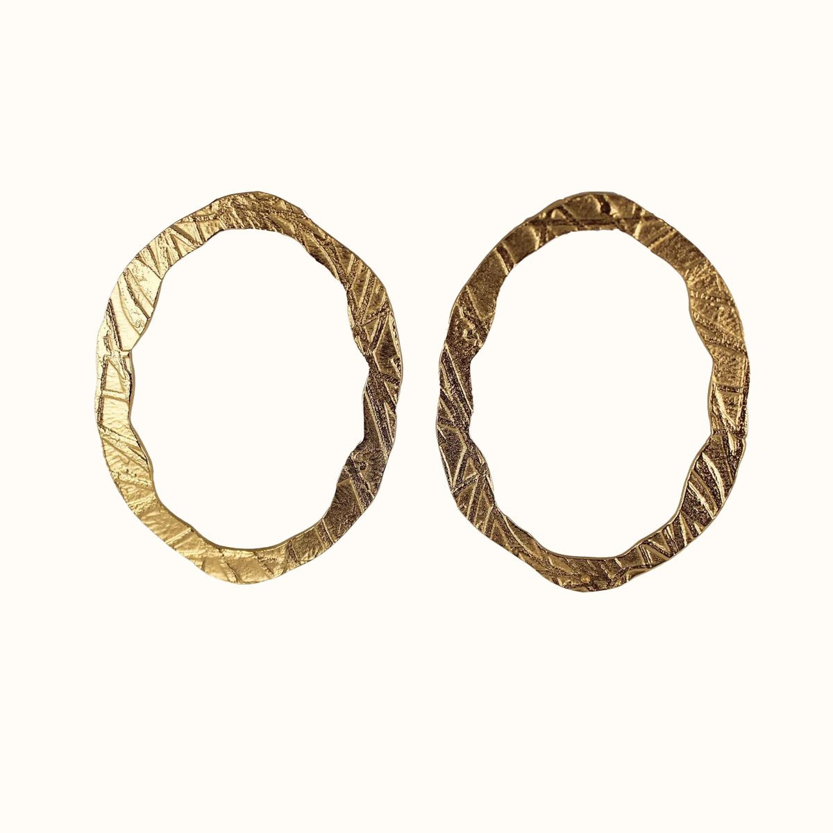 A 22kt gold plated stud earring. The Portal of Faith Earrings are designed and handcrafted by Lingua Nigra in Chicago, Illinois.