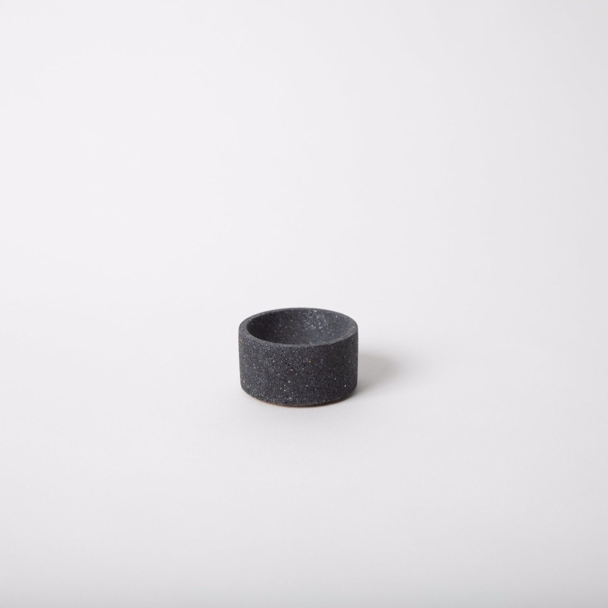 Terrazzo incense holder in the shade black. Holds a single stick of incense. Made by Pretti.Cool in Houston, Texas.