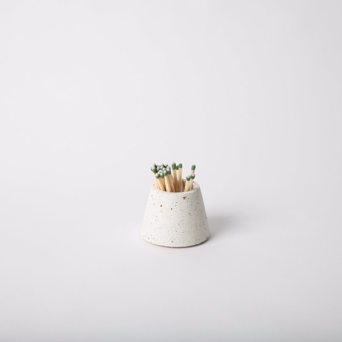 Terrazzo concrete matchstick holder in the shade white. Made by Pretti.Cool in Houston, Texas.